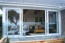 Garden room with sliding glass doors onto the terrace